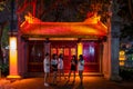 Hanoi, Vietnam - April 15, 2018: Young girls chat near Cau The Huc in Hanoi.