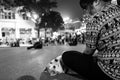 Hanoi, Vietnam - April 13, 2018: Young vietnamese woman pets dog in Hanoi.