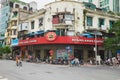 Hanoi, Vietnam - Aug 30, 2015: Front exterior view of Highlands Coffee on Le Duan street, with vehicles transporting on street