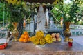 Offerings of fresh tropical fruits to Buddha statue
