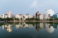 Hanoi, Vietnam - circa September 2015: Apartment buildings around lake in residential area of Hanoi, Vietnam Royalty Free Stock Photo