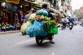 Courier delivering vegetables on a bike in Hanoi, Vietnam Royalty Free Stock Photo