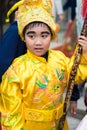 Hanoi, Vietnam - Feb 7, 2015: Portrait of school boy making up to old Vietnamese king before the show at Vietnamese lunar new year