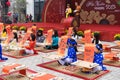 Hanoi, Vietnam - Feb 7, 2015: School children in traditional dress Ao Dai learning with calligraphy at Vietnamese lunar New Year c