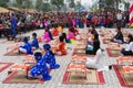 Hanoi, Vietnam - Feb 7, 2015: School children in traditional dress Ao Dai learning with calligraphy at Vietnamese lunar New Year c