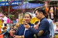 Hanoi, Vietnam - Jan 26, 2017: A mother and her son take a walk buying decoration and flower for Vietnamese lunar new year on Hang