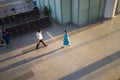 Hanoi, Vietnam - July 12, 2015: Blurred panning effect on Vietnamese air stewardess wearing Ao Dai walks at Hall of Noi Bai Intern