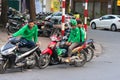 Hanoi, Vietnam - July 7, 2017: Gab motorbike driverswaiting for customer on Ba Trieu street. Entered Vietnam in 2014, Grab growing