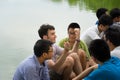 Hanoi, Vietnam - July 3, 2016: Group of students learn to speak English with English native foreigners at Hoan Kiem lake. A lot of