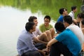 Hanoi, Vietnam - July 3, 2016: Group of students learn to speak English with English native foreigners at Hoan Kiem lake. A lot of