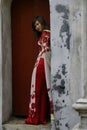 Hanoi, Vietnam - July 18, 2013; Pretty Vietnamese student girls photographing themselves on graduation day with traditional