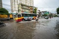 Hanoi, Vietnam - July 17, 2017: Traffic on flooded Minh Khai street after heavy rain with cars, motorcycles crossing deep water