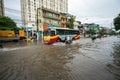 Hanoi, Vietnam - July 17, 2017: Traffic on flooded Minh Khai street after heavy rain with cars, motorcycles crossing deep water Royalty Free Stock Photo