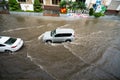 Hanoi, Vietnam - July 17, 2017: Traffic on flooded Minh Khai street after heavy rain with cars, motorcycles crossing deep water