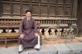 Old man with ancient feudal traditional long dress Ao Dai for his feudal official role in communal Royalty Free Stock Photo