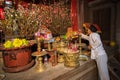 Hanoi, Vietnam - Jun 22, 2017: Old man preparing worship offerings on altar on holiday in communal house at So village, Quoc Oai