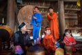 Vietnamese old traditional folk singer with children learning to play folk instruments in communal Royalty Free Stock Photo