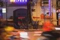 Cyclos parked on a roadside pavement at night in the old quarter of Hanoi