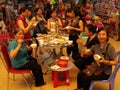 A group of women eat inside the Dong Xuan market in Hanoi