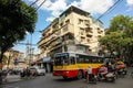 Traffic with buses and motorbikes on a busy street in the old quarter area of the city of Hanoi Royalty Free Stock Photo