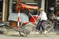 Hanoi, Vietnam, : Life in vietnam- Cyclo beside Sword lake in hanoi, vietnam. Cyclo is the tourist`s farvourite vehicle Royalty Free Stock Photo