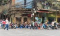 Hanoi, Vietnam - Mar 15, 2015: People drink coffee, tea or juice fruit on cafe stall on sidewalk in Nha Tho street, center of Hano