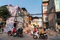 Hanoi, Vietnam - Mar 10, 2018: Urban resident houses are dismantled and demolished by machine. Land cleanrance progress to widen