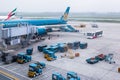 Vietnam Airlines aircraft loading air cargo containers before flight at Noi Bai international airport in Hanoi, Vietnam Royalty Free Stock Photo