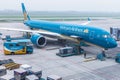 Vietnam Airlines aircraft loading air cargo containers before flight at Noi Bai international airport in Hanoi, Vietnam Royalty Free Stock Photo