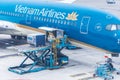 Vietnam Airlines aircraft loading air cargo containers before flight at Noi Bai international airport in Hanoi, Vietnam Royalty Free Stock Photo