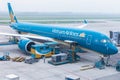 Vietnam Airlines aircraft loading air cargo containers before flight at Noi Bai international airport in Hanoi, Vietnam Royalty Free Stock Photo