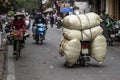 Transportation of goods by motorcycle on the street in old town Hanoi, Vietnam Royalty Free Stock Photo