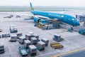 Vietnam Airlines aircraft loading air cargo containers before flight at Noi Bai international airport in Hanoi, Vietnam Royalty Free Stock Photo