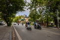 Hanoi, Vietnam - May 28, 2023: Enchanting Old town streets reveal a vibrant tableau: motorcycles and bicycles whizzing by,