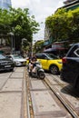 Hanoi, Vietnam - May 28, 2023: Enchanting Old town streets reveal a vibrant tableau: motorcycles and bicycles whizzing by,