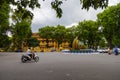 Hanoi, Vietnam - May 28, 2023: Enchanting Old town streets reveal a vibrant tableau: motorcycles and bicycles whizzing by,