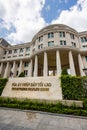 The imposing People\'s Supreme Court building stands resplendent under a clear blue sky. Its grand,