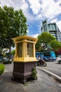Hanoi, Vietnam - May 28, 2023: A quaint, compact police hut perched at a bustling intersection. Uniformed officers diligently