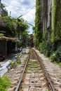 Hanoi, Vietnam - May 28, 2023: Train Street in Hanoi is a narrow, bustling lane with tracks. Close knit houses, adorned with