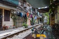 Hanoi, Vietnam - May 28, 2023: Train Street in Hanoi is a narrow, bustling lane with tracks. Close knit houses, adorned with