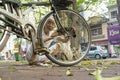 Hanoi, Vietnam - May 2, 2014: Unidentified old man fixing his bicycle on street side in Phan Dinh Phung str, Hanoi, Vietnam