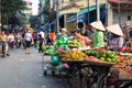 HANOI, VIETNAM - MAY 22, 2017: Woman selling tropical fruit on a