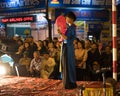 Hanoi, Vietnam - Nov 2, 2014: Dancer with red fan and old traditional clothes performs ancient dance of folk music and song. The s