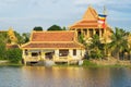 Hanoi, Vietnam - Nov 15, 2015: Exterior view of Khmer temple building by river in ethnic village in Mo, Hanoi