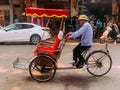 Hanoi, Vietnam - November 15,2019 : Asian man rides rickshaw