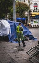 Hanoi, Vietnam - November 13,2019 : City worker looks at mobile