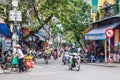 Local daily life and view of busy traffic with motorbikes in Hanoi Old Quarter, capital of Vietnam.People can seen exploring it. Royalty Free Stock Photo