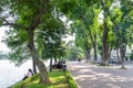 Scenic view of the lakeside of Hoan Kiem Lake, people can seen relaxing and exploring around it.
