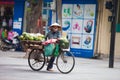 Hanoi, Vietnam - November 21, 2019: Street vendors are hurriedly cycling across the street to find customers in the small neighbor