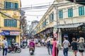 View of busy traffic in an intersection with many motorbikes and people in Hanoi Old Quarter, capital of Vietnam. Royalty Free Stock Photo